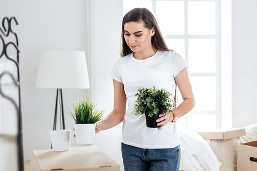 close up. young woman placing her things in a new apartment.