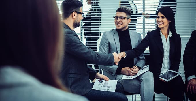handshake of colleagues before the business seminar. concept of cooperation