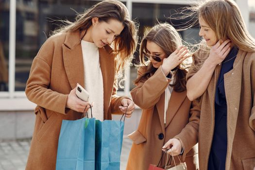 Girls on a shopping. Friends walks. Women with a shopping bags.