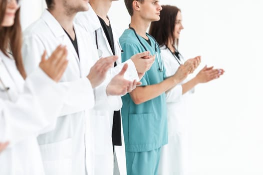 close up.a team of leading medics applauding together. photo with copy space