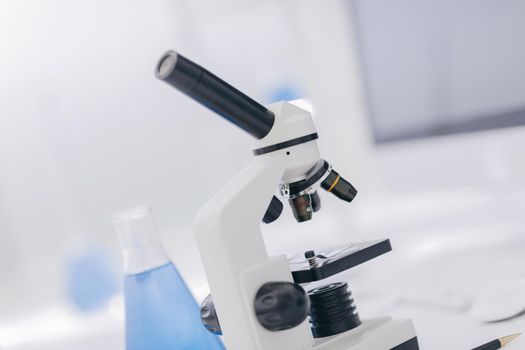 close up.microscope on the table in the science lab. science and technology