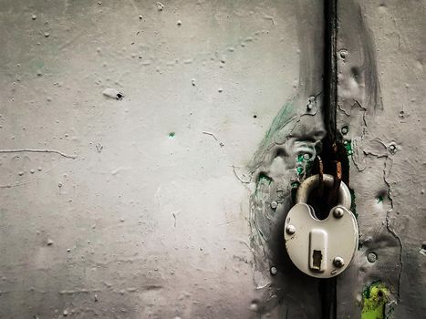 close up. padlock on painted iron door. photo with copy space