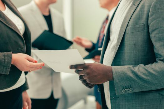 close up. business colleagues discussing a business document. office workdays