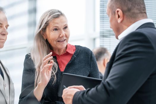 close up. a group of business people discussing business issues in a modern office