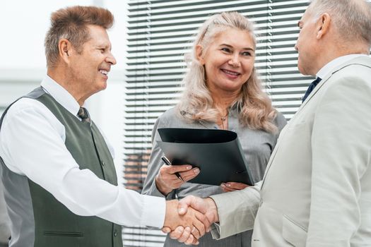 close up. business people confirming the deal with a handshake. office weekdays