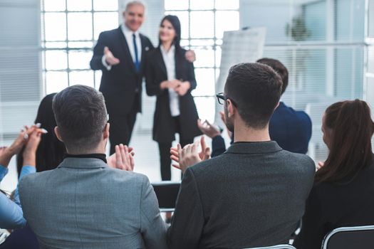 project Manager representing a young specialist during a working meeting. success concept