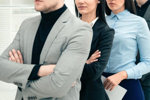 successful businessman standing ahead of his business team. the concept of teamwork