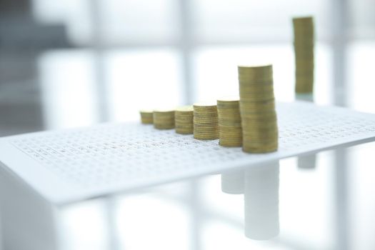 business background.stacks of gold coins on the table . photo with copy space