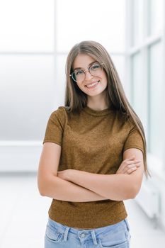 attractive young woman standing in bright office office. photo with copy space