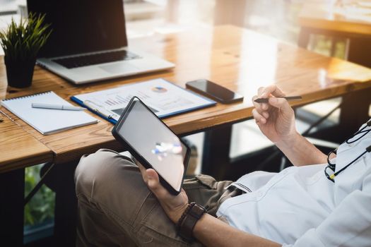 Financial Freedom, a stock analyst holding a pen pointing at a tablet Analyze the stock market to make a profit for your own portfolio