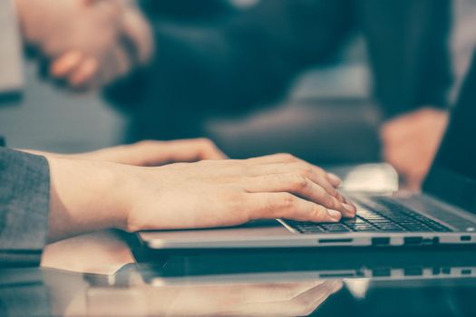 close up. modern man typing on a laptop keyboard. people and technology