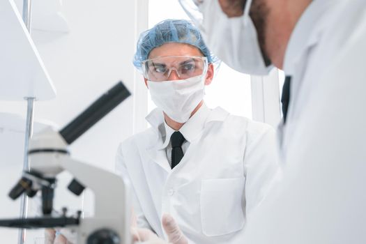 close up. group of scientists discussing the results of testing.