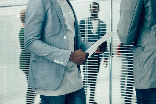 close up. office employees discussing a business document. office workdays