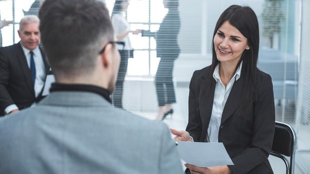 business woman discussing something with a colleague before a business meeting. office workdays