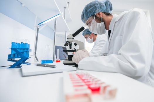 group of scientists conducts research in the laboratory . photo with a copy-space