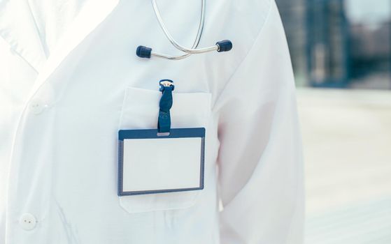 close up. blank badge on the chest of the doctor paramedic. photo with a copy-space.