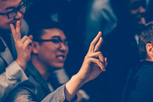 close up. young entrepreneur asking a question to a speaker at a business seminar