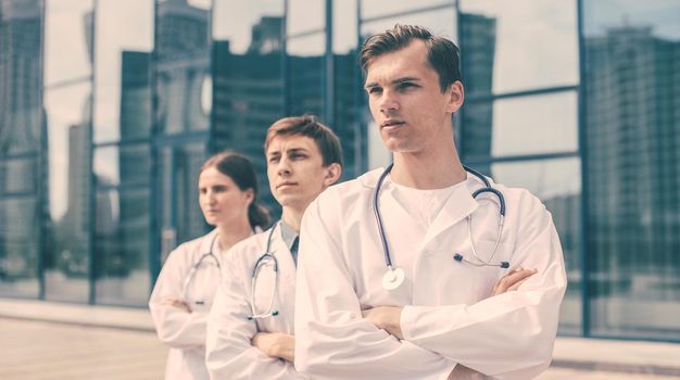 close up. team of doctors standing on a city street. photo with a copy-space.