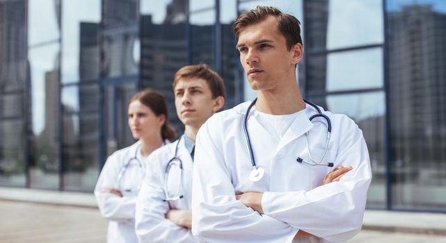 close up. team of doctors standing on a city street. photo with a copy-space.
