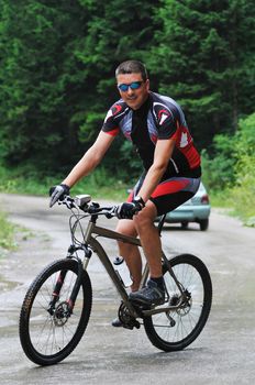 healthy lifestyle and fitness concept with mount bike man outdoor