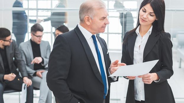 businessman and businesswoman discussing a business document. office workdays