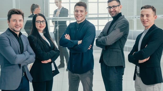 close up. group of young professionals standing in the office. business concept.