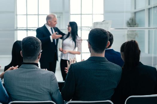 boss introducing a speaker at a business presentation. business concept