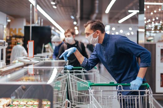 close up. young man choosing products in a supermarket. hygiene and health care