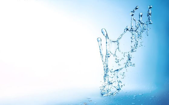 Water splashes with copy space, blue background