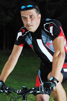healthy lifestyle and fitness concept with mount bike man who ride bike  outdoor