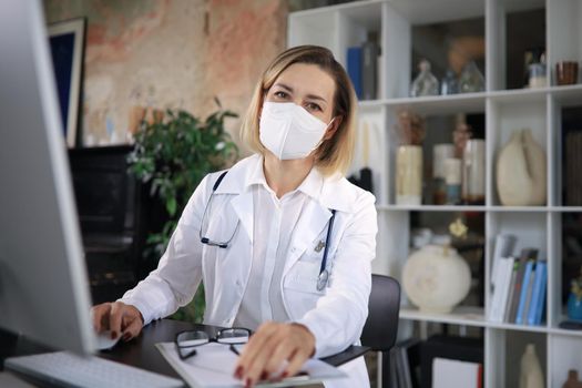 Middle aged female doctor therapist on consultation