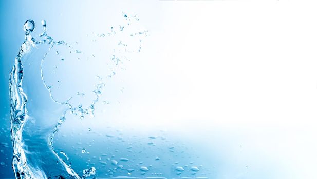 Water splashes with copy space, blue background