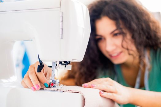 Close up view of sewing female hands