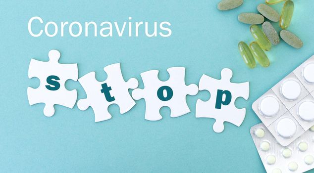 Coronavirus STOP puzzle pieces in row with pills