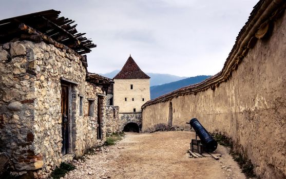 Beautiful Rasnov Citadel courtyard with cannon