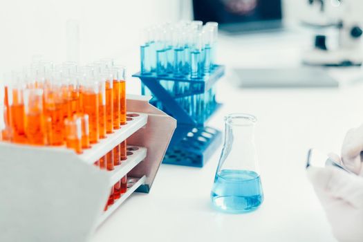 image of containers with test tubes on a table in the laboratory. photo with a copy-space.