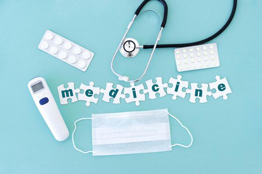 Top view of medical equipment and blank puzzle pieces