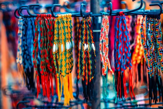 Close up view of colorful handmade bracelets assortment for sell