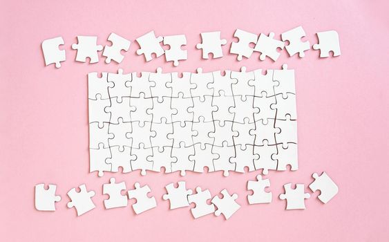 White jigsaw puzzle with unconnected pieces