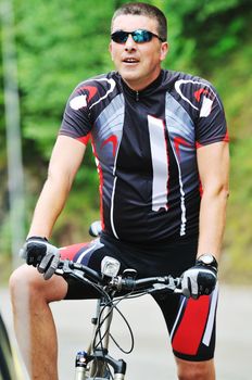 healthy lifestyle and fitness concept with mount bike man outdoor