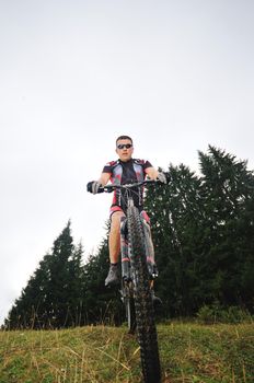 healthy lifestyle and fitness concept with mount bike man outdoor