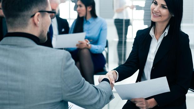 close up. businesswoman shaking hands with her business partner. concept of cooperation