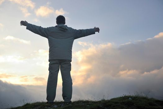 healthy young man practice youga in height mountain at early morning and sunrise