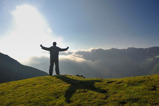 healthy young man practice youga in height mountain at early morning and sunrise