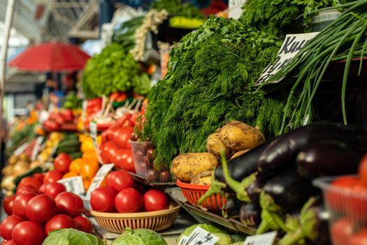 Stock photo of fresh greens and veggies are being sold at the local market. Local farmers’ production at the market.