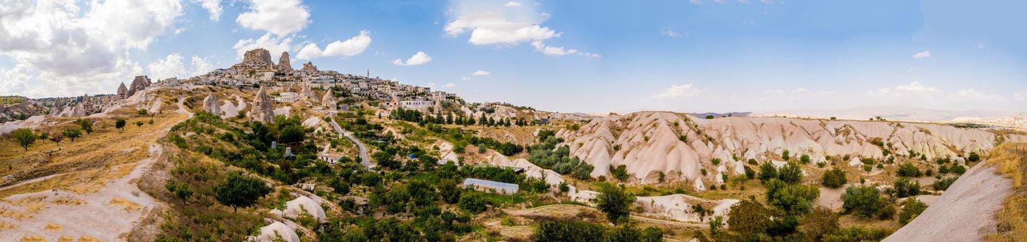 Panoramic view of turkish Uchisar with houses and castle