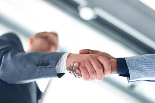 Business handshake. Business man giving a handshake to close the deal