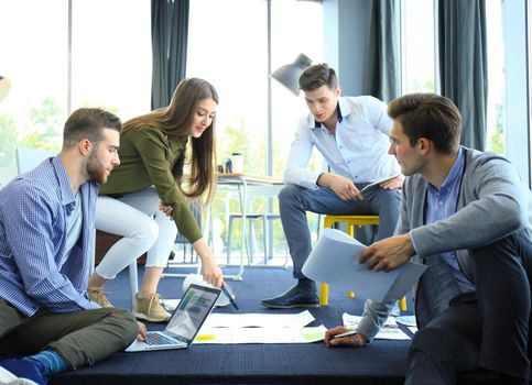 Group of young business people. They working on new project. Startup concept.
