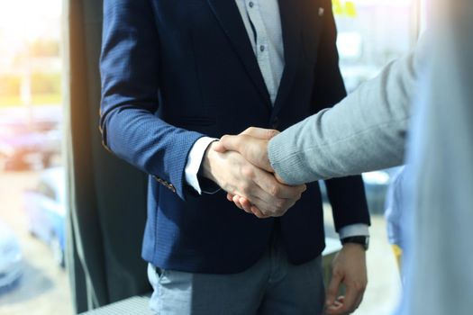 Business people shaking hands, finishing up a meeting