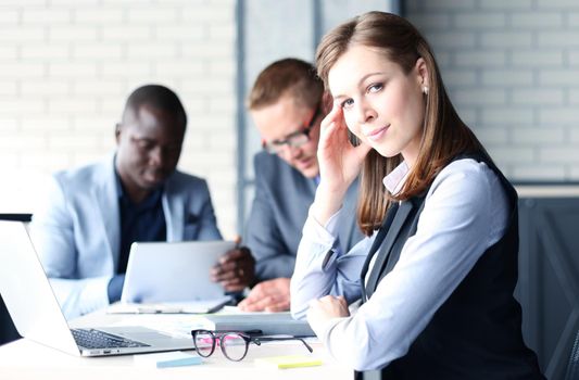 business woman with her staff, people group in background at modern bright office indoors